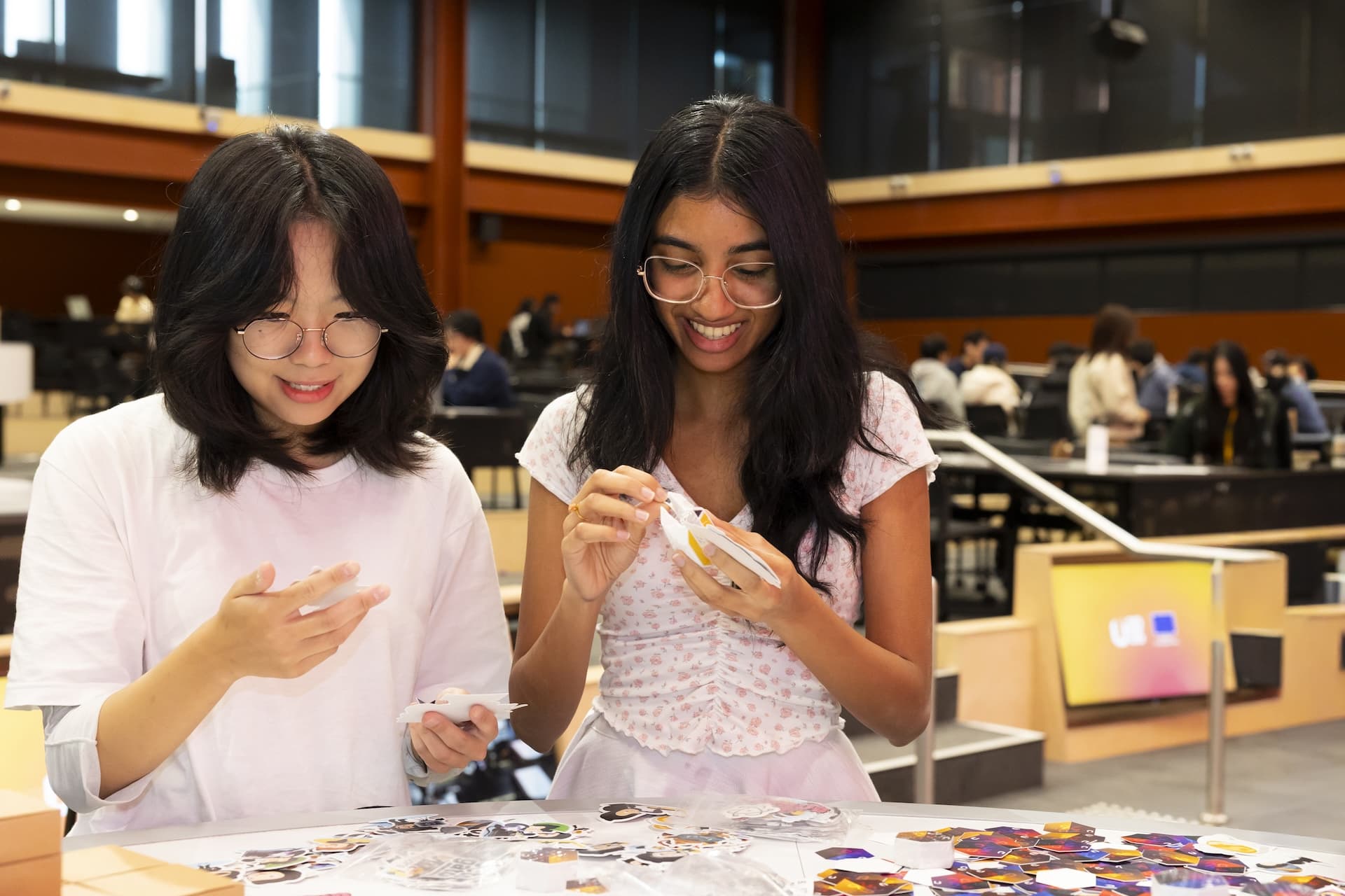 Students looking at stickers
