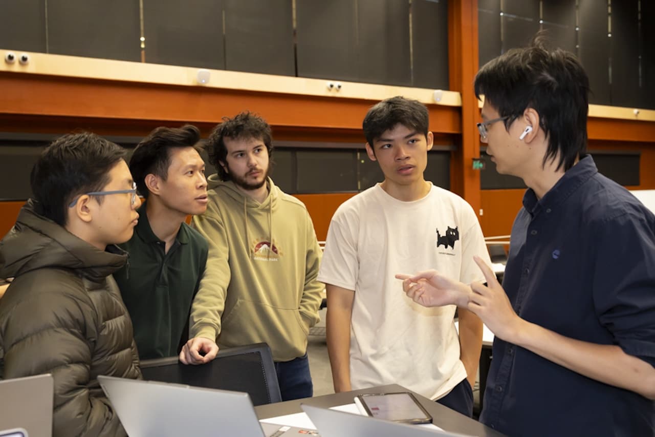 Someone mentoring students at UNIHACK 2026